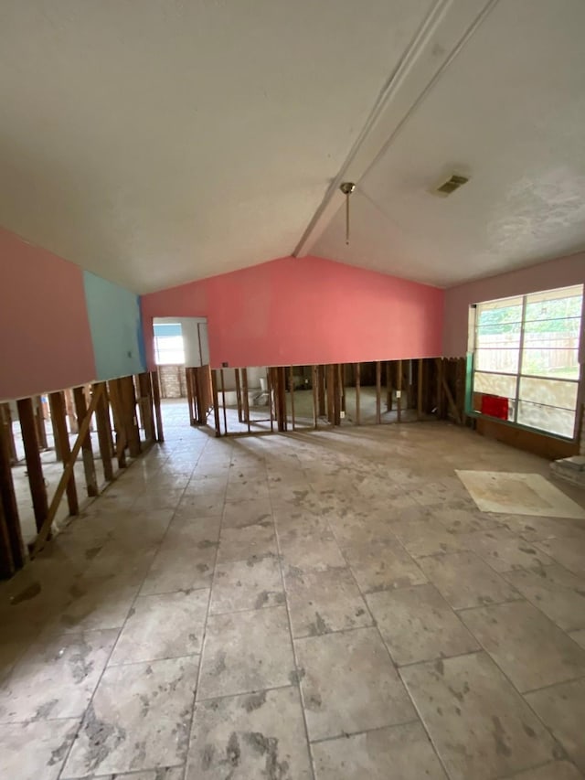 empty room with vaulted ceiling