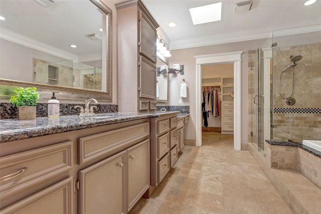 bathroom with a skylight, crown molding, vanity, and plus walk in shower