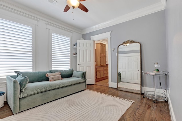 living room with crown molding, hardwood / wood-style floors, and ceiling fan