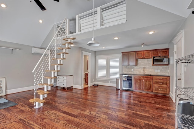 kitchen with sink, dark hardwood / wood-style flooring, beverage cooler, and backsplash