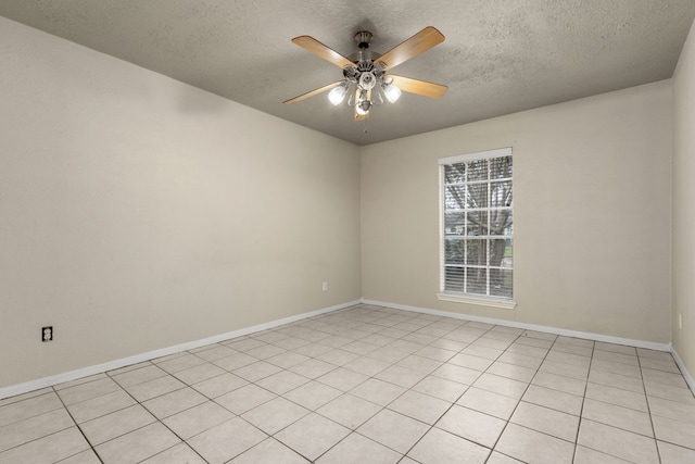 tiled spare room with ceiling fan and a textured ceiling