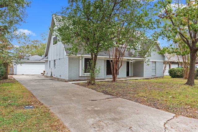 view of front of property with a front yard and a garage