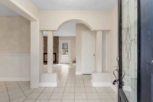 foyer entrance with light tile patterned floors