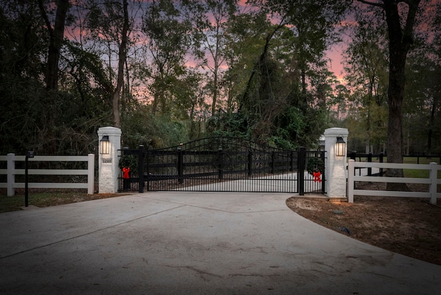 view of gate at dusk