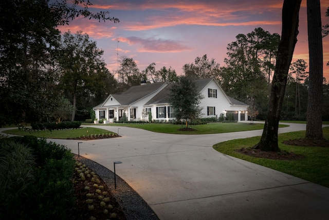 view of front of property with a lawn