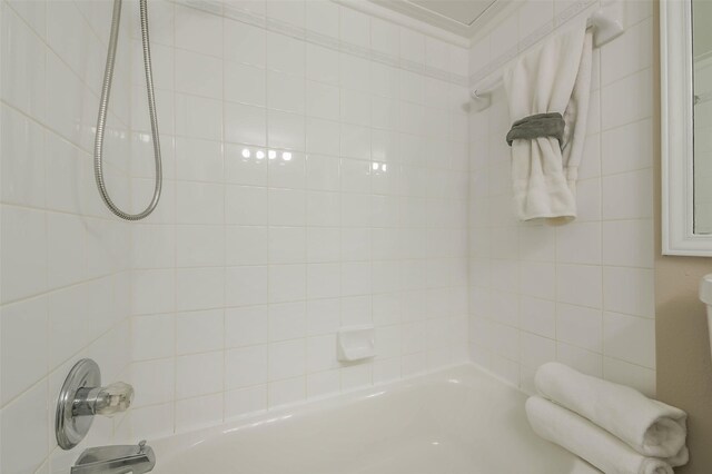 bathroom featuring washtub / shower combination