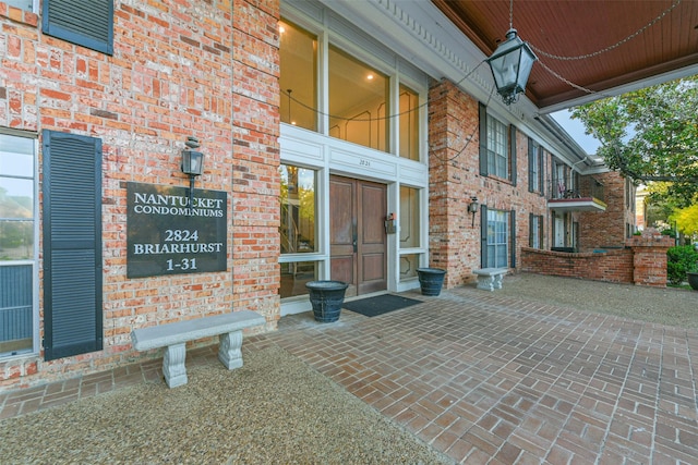 property entrance with brick siding