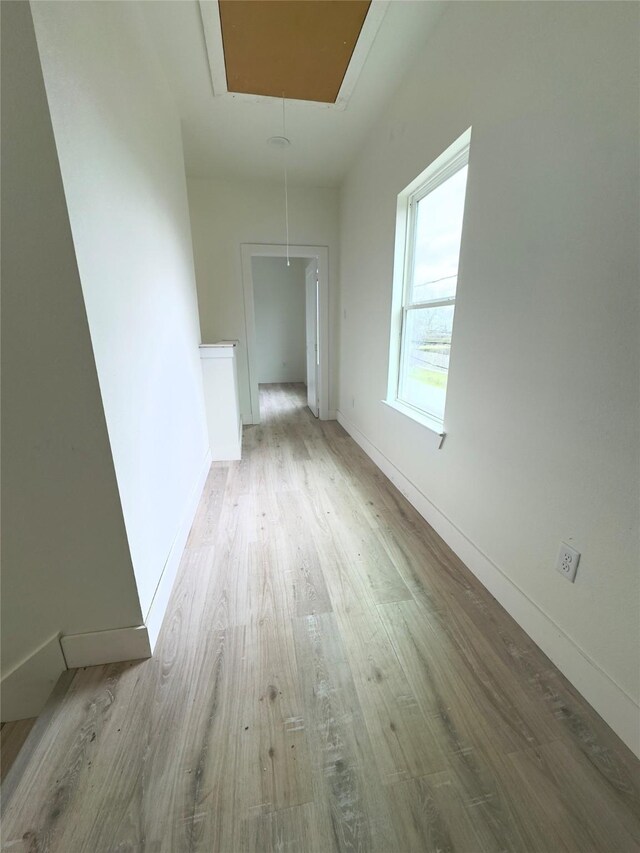 hall with light hardwood / wood-style flooring