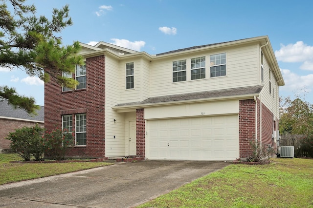 view of front property featuring a garage, central AC, and a front yard