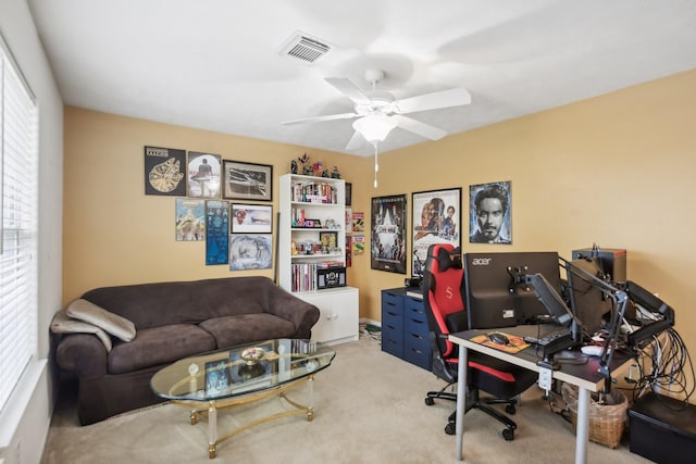 office area with ceiling fan and carpet flooring