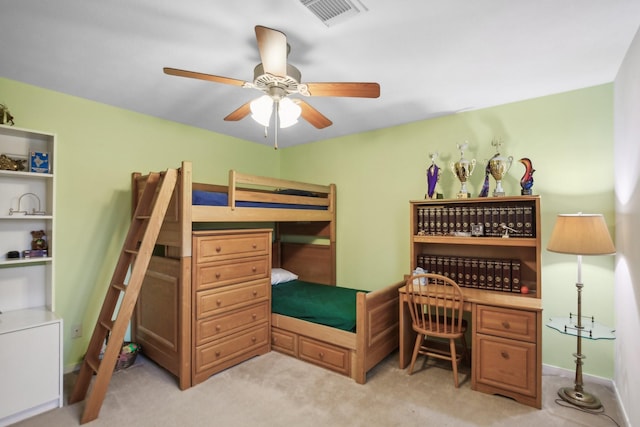 bedroom featuring ceiling fan and light carpet