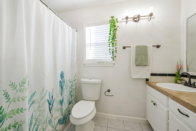 bathroom featuring baseboards, toilet, a shower with shower curtain, tile patterned floors, and vanity