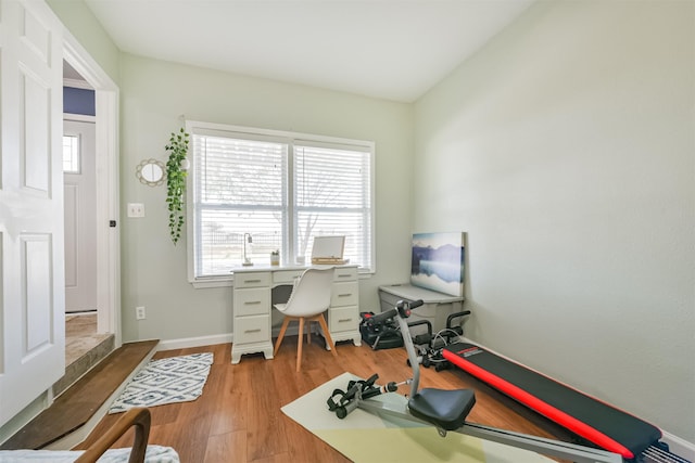 office with wood finished floors and baseboards