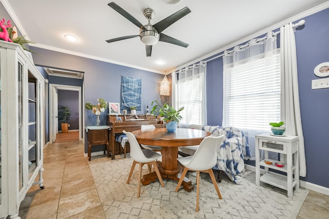 dining area with crown molding, baseboards, and ceiling fan