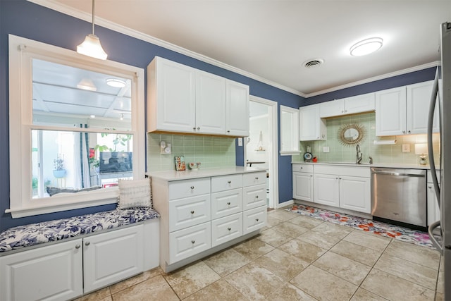 kitchen with tasteful backsplash, hanging light fixtures, stainless steel dishwasher, white cabinets, and sink