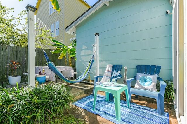 view of patio / terrace featuring fence