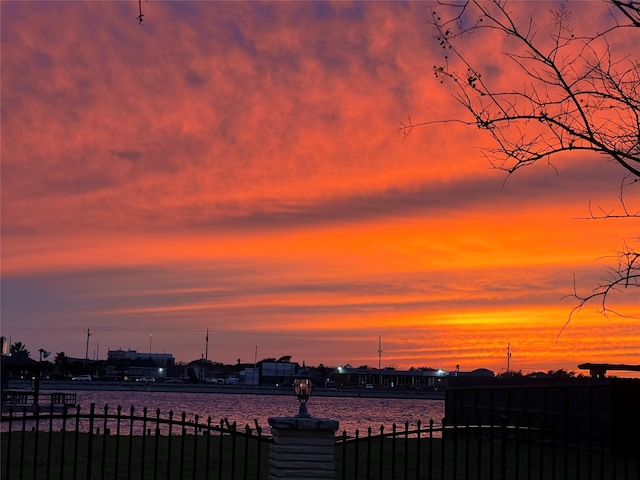 yard at dusk with a water view