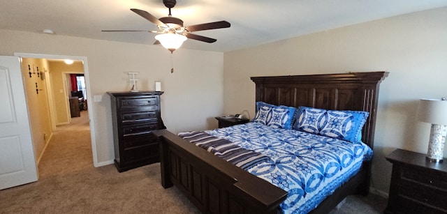 bedroom with ceiling fan and light carpet