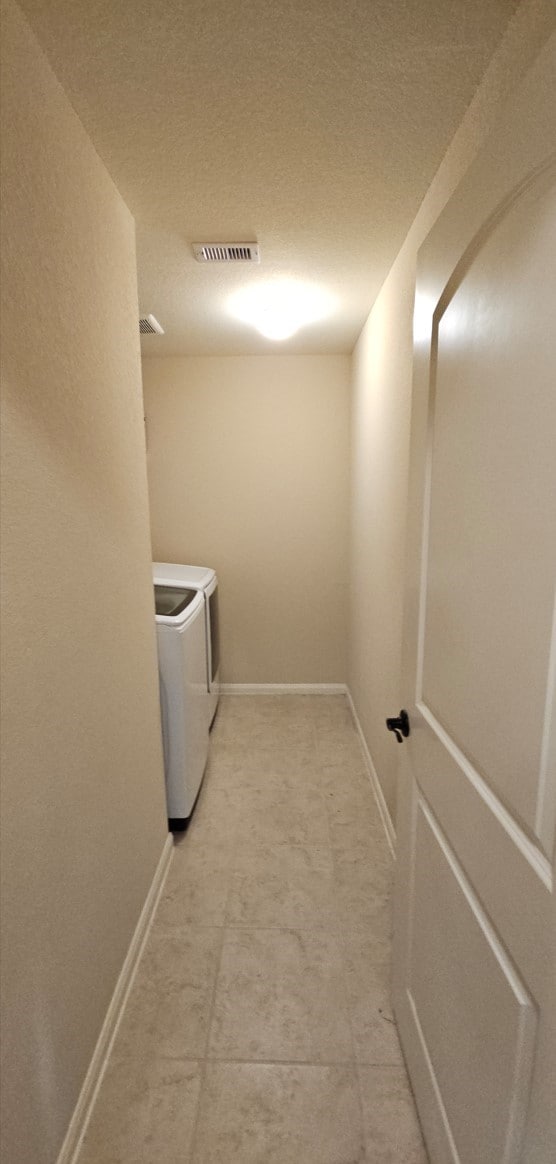 laundry room with washer and clothes dryer