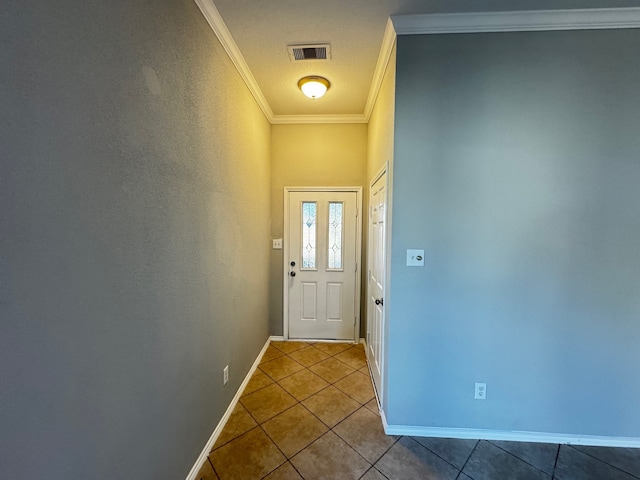 entryway with tile patterned flooring and ornamental molding