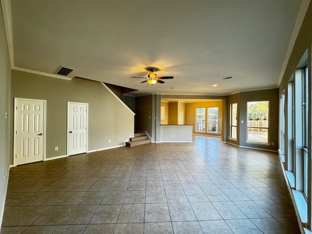 unfurnished living room with tile patterned flooring, ceiling fan, and crown molding