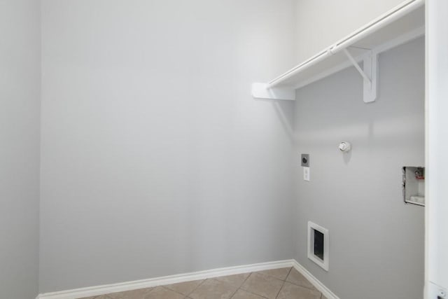 laundry area featuring electric dryer hookup, hookup for a washing machine, and light tile patterned flooring