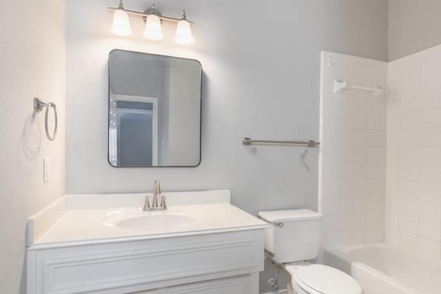 full bathroom with shower / tub combination, vanity, and toilet