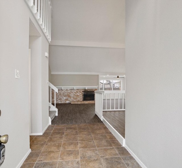 hallway featuring a towering ceiling