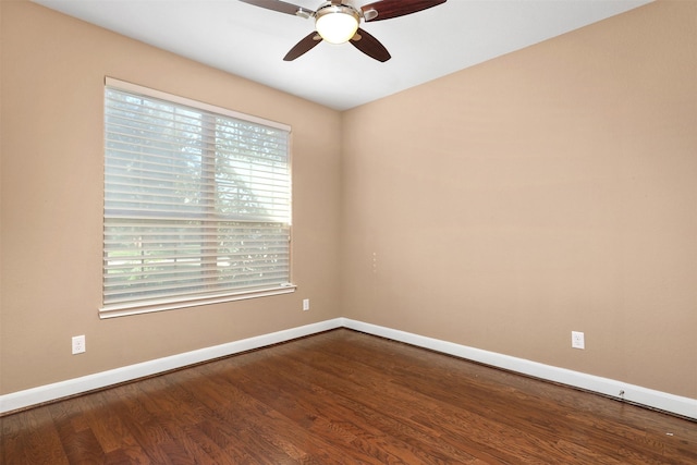 empty room featuring ceiling fan and hardwood / wood-style floors