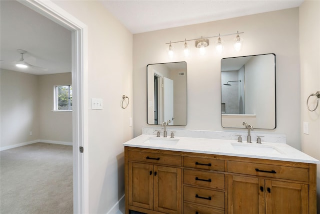 1300 Augusta Dr Unit 12, Houston, TX 77057 - full bathroom with double vanity and a ceiling fan