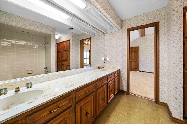 bathroom featuring vanity and vaulted ceiling