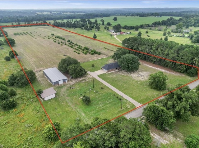 birds eye view of property with a rural view