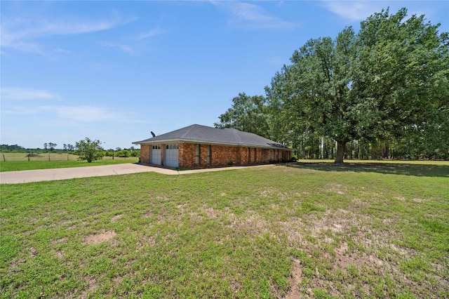 exterior space featuring a front yard and a garage