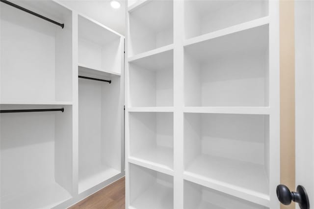 spacious closet featuring hardwood / wood-style floors