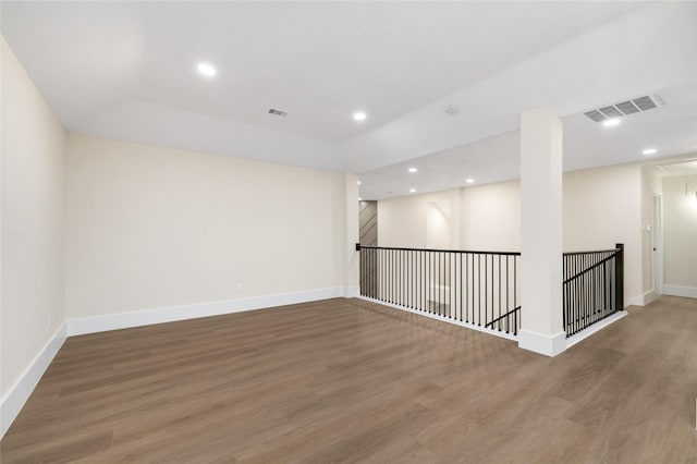 empty room featuring dark hardwood / wood-style flooring