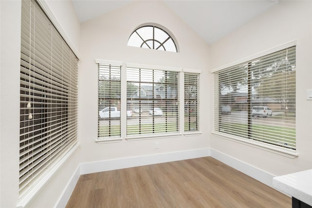 unfurnished sunroom with vaulted ceiling