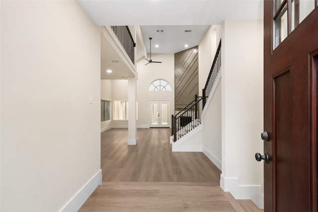 foyer featuring a high ceiling and light wood-type flooring