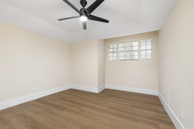 unfurnished room featuring dark hardwood / wood-style flooring and ceiling fan