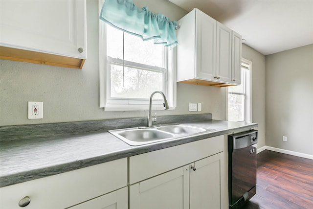 kitchen with sink, white cabinets, dark wood-type flooring, and black dishwasher