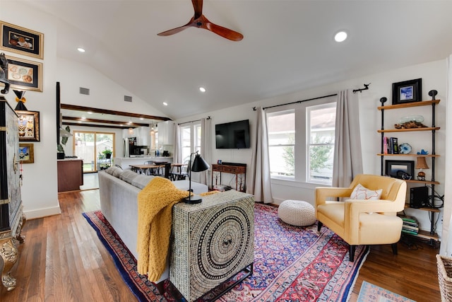 living room featuring hardwood / wood-style floors, ceiling fan, and lofted ceiling