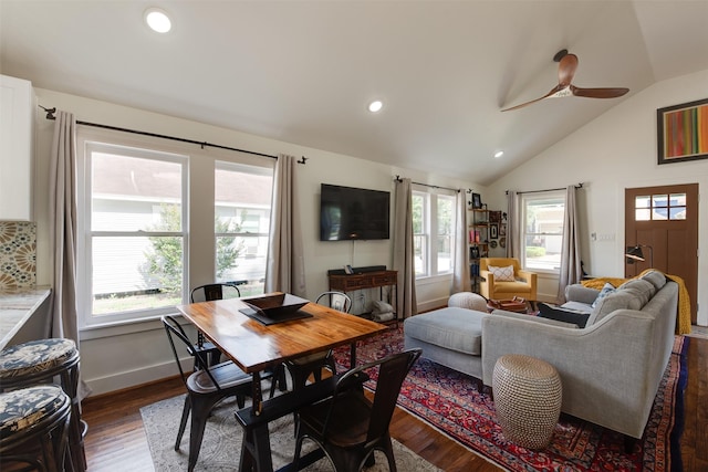 interior space featuring dark hardwood / wood-style floors, vaulted ceiling, a wealth of natural light, and ceiling fan