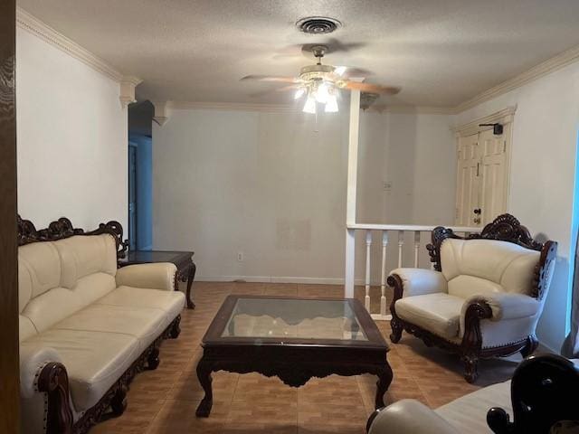 sitting room featuring a textured ceiling, tile patterned floors, ceiling fan, and ornamental molding