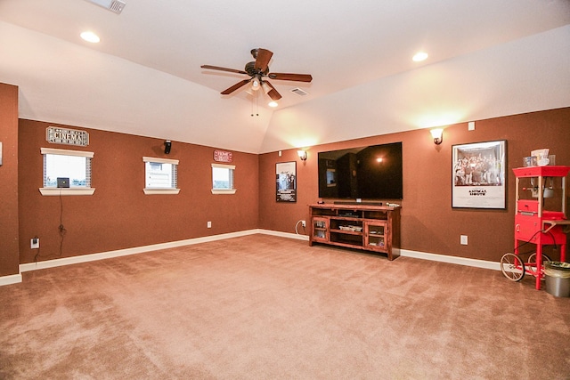 interior space with carpet flooring, ceiling fan, and lofted ceiling