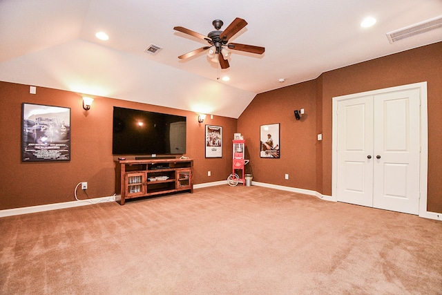 unfurnished living room with ceiling fan, carpet, and lofted ceiling