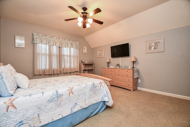 bedroom featuring ceiling fan, carpet floors, and vaulted ceiling