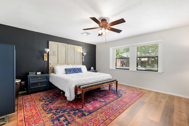 bedroom featuring ceiling fan and wood-type flooring