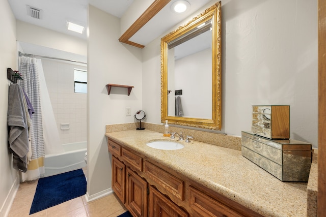 full bathroom with tile patterned floors, vanity, shower / bath combo, and toilet