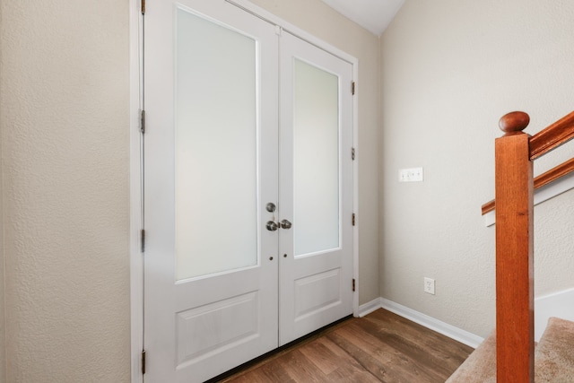 entryway featuring french doors and dark wood-type flooring