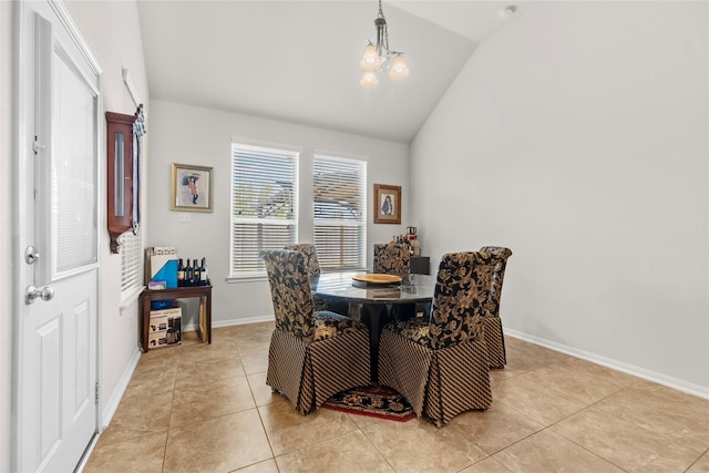 tiled dining area with a chandelier and vaulted ceiling