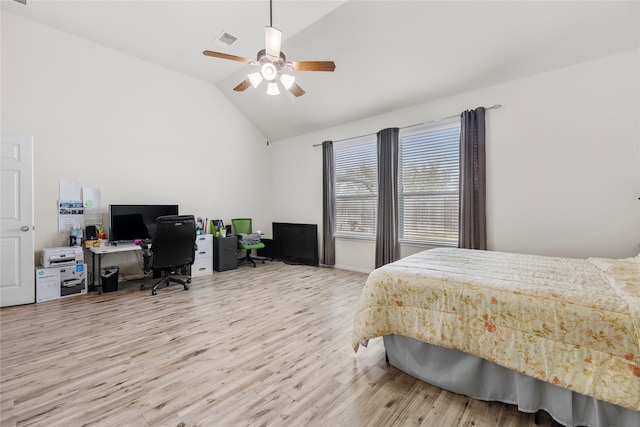 bedroom featuring light hardwood / wood-style floors, ceiling fan, and lofted ceiling